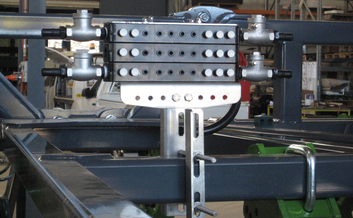 Dual Stacker Manifold with 1 x 50:50 half system shut-off mounted onto a Boss AG Strip Till Bar